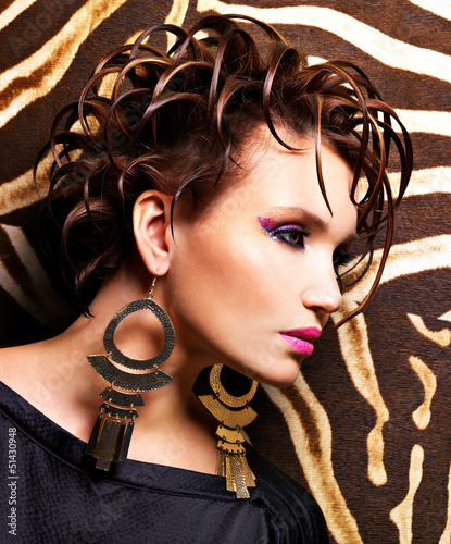 Photo: Woman with fashion hairstyle and glamour makeup Woman with fashion hairstyle and glamour makeup