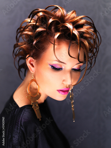 Photo: Beautiful woman with fashion hairstyle and pink makeup Beautiful woman with fashion hairstyle and pink makeup