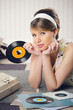 A woman listening to a record