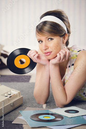Photo: A woman listening to a record A woman listening to a record