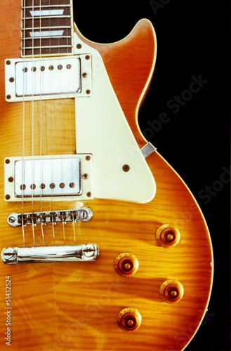 Photo: close up of brown Electric guitar close up of brown Electric guitar