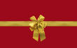 paquet cadeau rouge et ruban doré