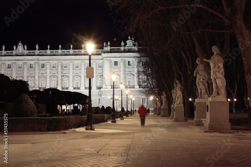 Photo: Alley and statues near majestic Royal Palace at night in Madrid, Alley and statues near majestic Royal Palace at night in Madrid,