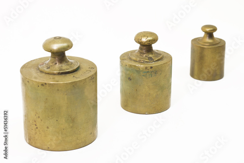 Photo: Three antique weights isolated on white Three antique weights isolated on white
