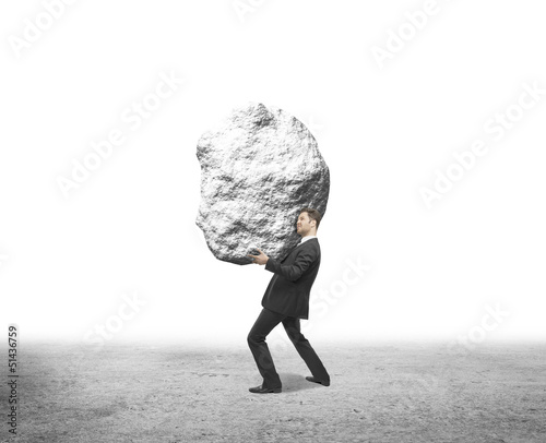 Photo: businessman holding rock businessman holding rock