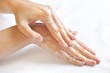 Washing woman hands on a background a white towel