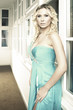 Beauty in blue dress on corridor
