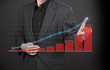 Business men hand pushing write graph