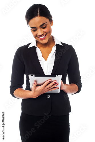 Photo: Company manager browsing on tablet pc Company manager browsing on tablet pc