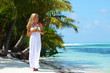 woman with a coconut cocktail