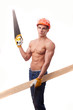 Muscular young worker in an orange helmet with the board on a wh