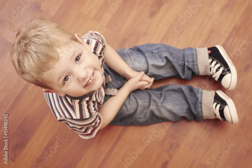 Photo: Fashion cute child on the floor Fashion cute child on the floor