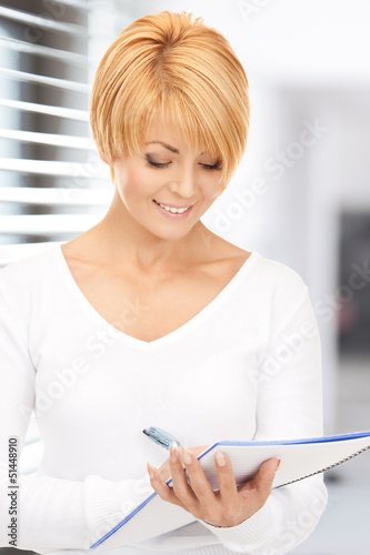 Photo: attractive businesswoman with notebook attractive businesswoman with notebook