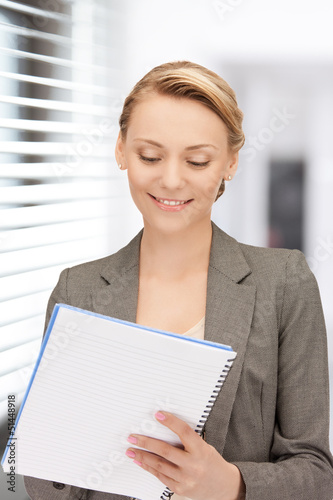 Photo: happy woman with big notepad happy woman with big notepad
