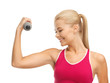 young sporty woman with light dumbbell