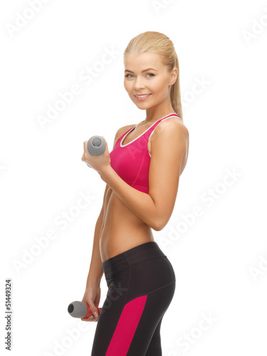 Photo: young sporty woman with light dumbbells young sporty woman with light dumbbells
