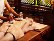 Woman having massage with pouch.
