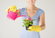 woman holding pot with flower