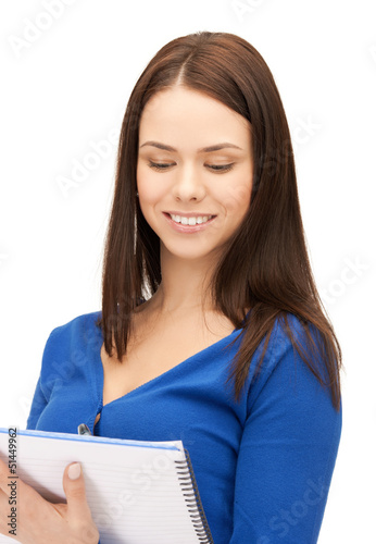 Photo: smiling young businesswoman with notebook smiling young businesswoman with notebook