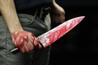 Man holding bloody knife