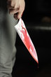 Man holding bloody knife