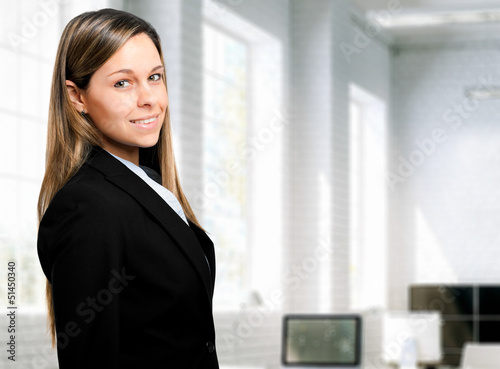 Photo: Beautiful businesswoman in her office Beautiful businesswoman in her office