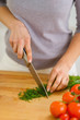 Photo: Closeup on woman cutting fresh dill Closeup on woman cutting fresh dill