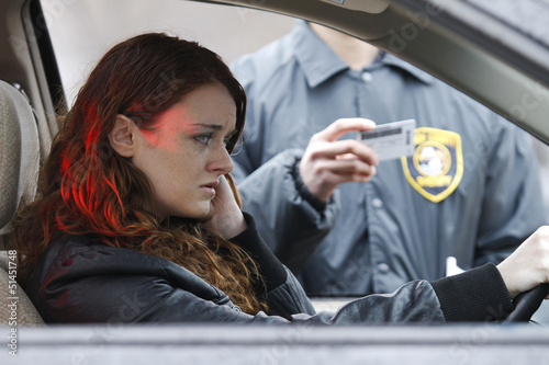 Photo: Young woman pulled over by cop Young woman pulled over by cop