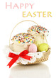 Easter cakes with eggs in wicker basket isolated on white