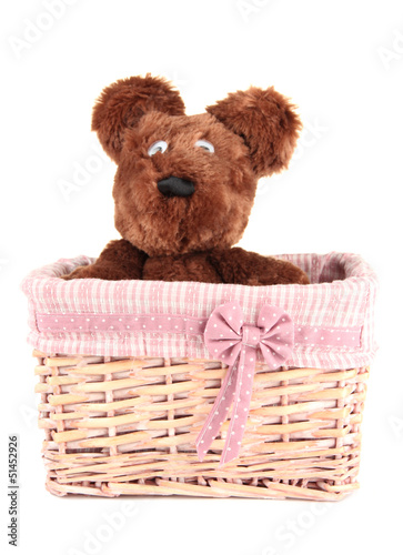 Photo: Beautiful basket with toy bear isolated on white Beautiful basket with toy bear isolated on white