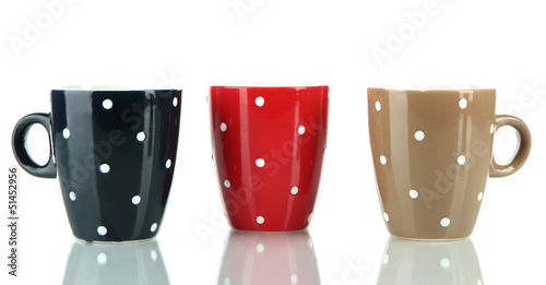 Photo: Three cups of polka dot isolated on white Three cups of polka dot isolated on white