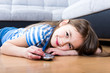 cute little girl holding a remote control