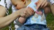 HD1080 7 Month old Baby with mother sitting on a swing.