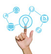 Foto: Hand pointing to business icons Hand pointing to business icons