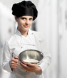 Photo: female chef holding stainless bowl with flour female chef holding stainless bowl with flour