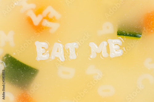 Photo: Alphabet soup drawing the words Eat Me Alphabet soup drawing the words Eat Me