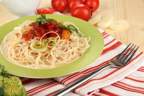 Photo: Tasty spaghetti with sauce and vegetables Tasty spaghetti with sauce and vegetables