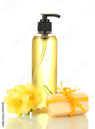 Photo: Liquid and hand-made soaps isolated on white Liquid and hand-made soaps isolated on white