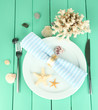 Marine table setting on color wooden background
