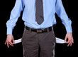 Business man showing his empty pockets, on black background