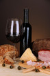 Exquisite still life of wine, cheese and meat products