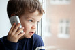 Portrait of boy with mobile phone