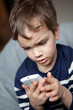 Photo: Portrait of boy with mobile phone Portrait of boy with mobile phone