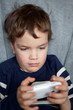 Portrait of boy with mobile phone