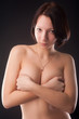 Photo: topless woman body covering her breasts topless woman body covering her breasts