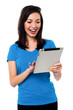 Young girl playing games on tablet device