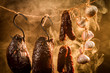 Photo: Ham, sausage and garlic in a homemade smokehouse Ham, sausage and garlic in a homemade smokehouse