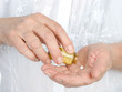 Medical pills in elderly hand