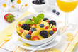 Cornflakes, fresh berries and orange juice for breakfast