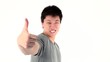 Asian young man showing thumbs up gesture